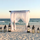 4-post wooden wedding pergola chuppa arbor arch rental in panama city beach beachy coastal romantic garden wedding Boho vibes