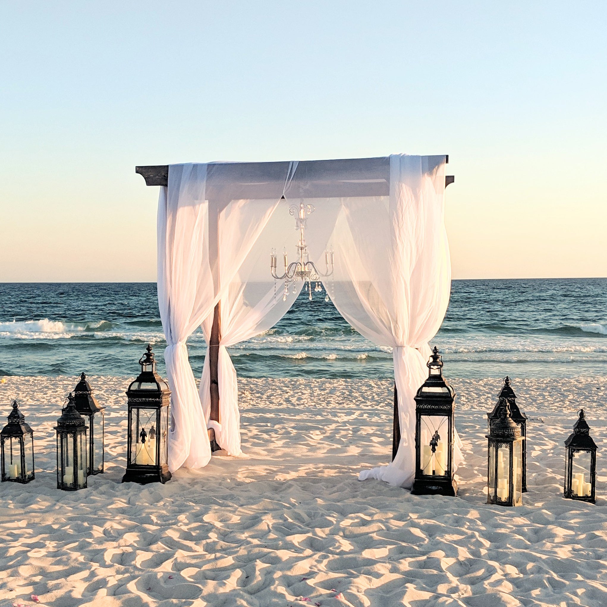 4-post wooden wedding pergola chuppa arbor arch rental in panama city beach beachy coastal romantic garden wedding Boho vibes