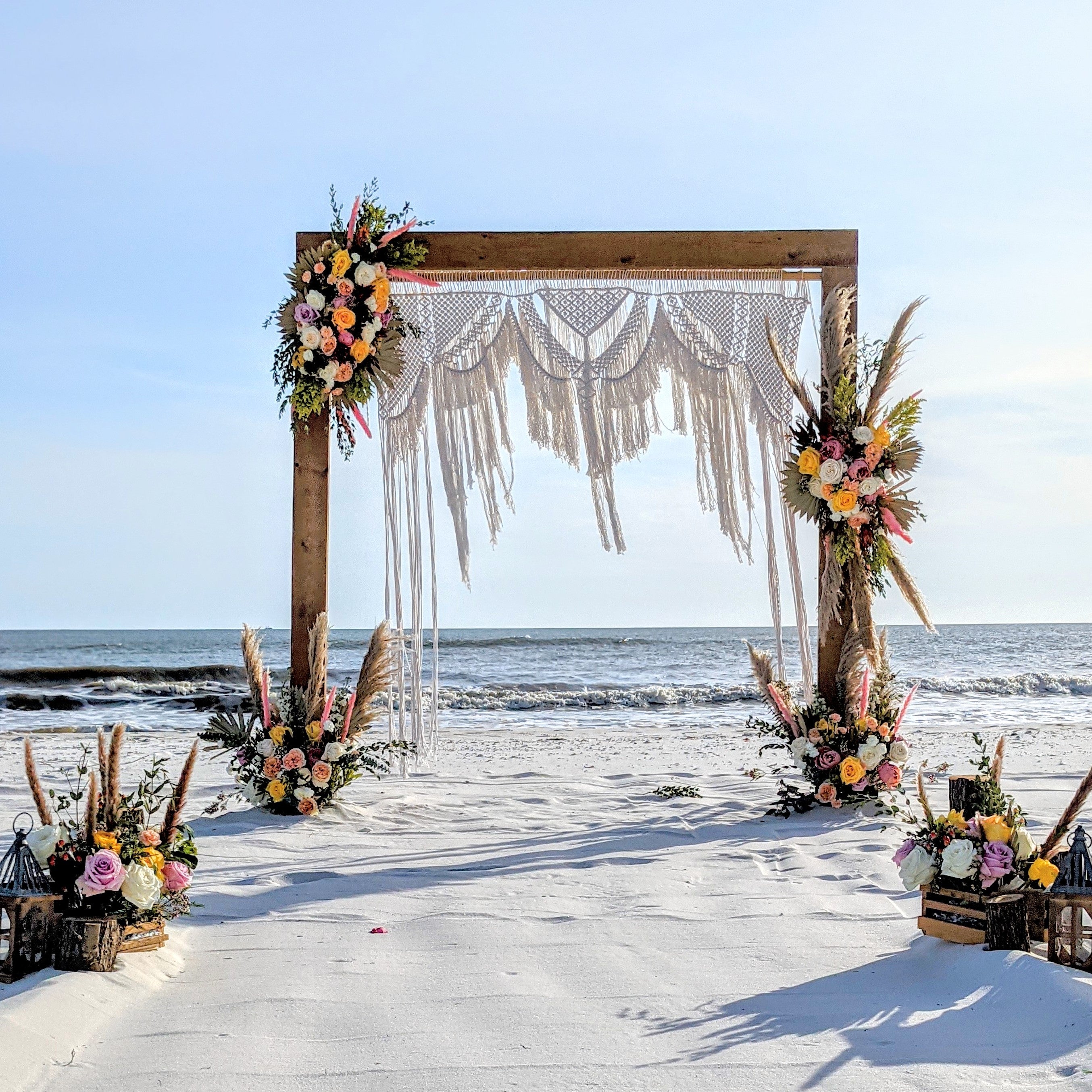 Boho Macrame Wedding arbor with wood arch included for rent in Panama City Beach FL