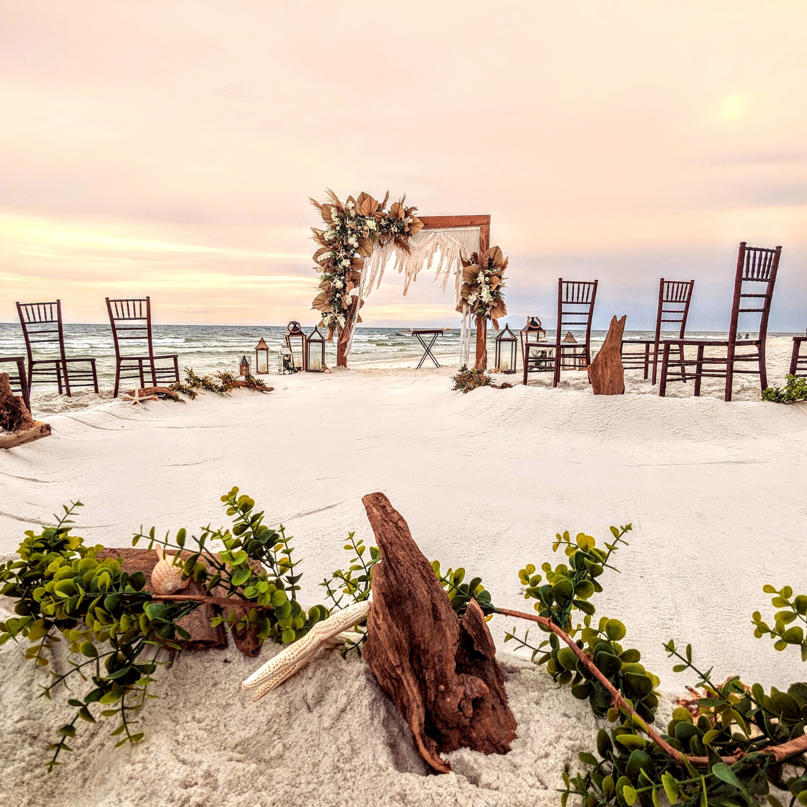 Boho Macrame Wedding arbor with wood arch included for rent in Panama City Beach FL with driftwood