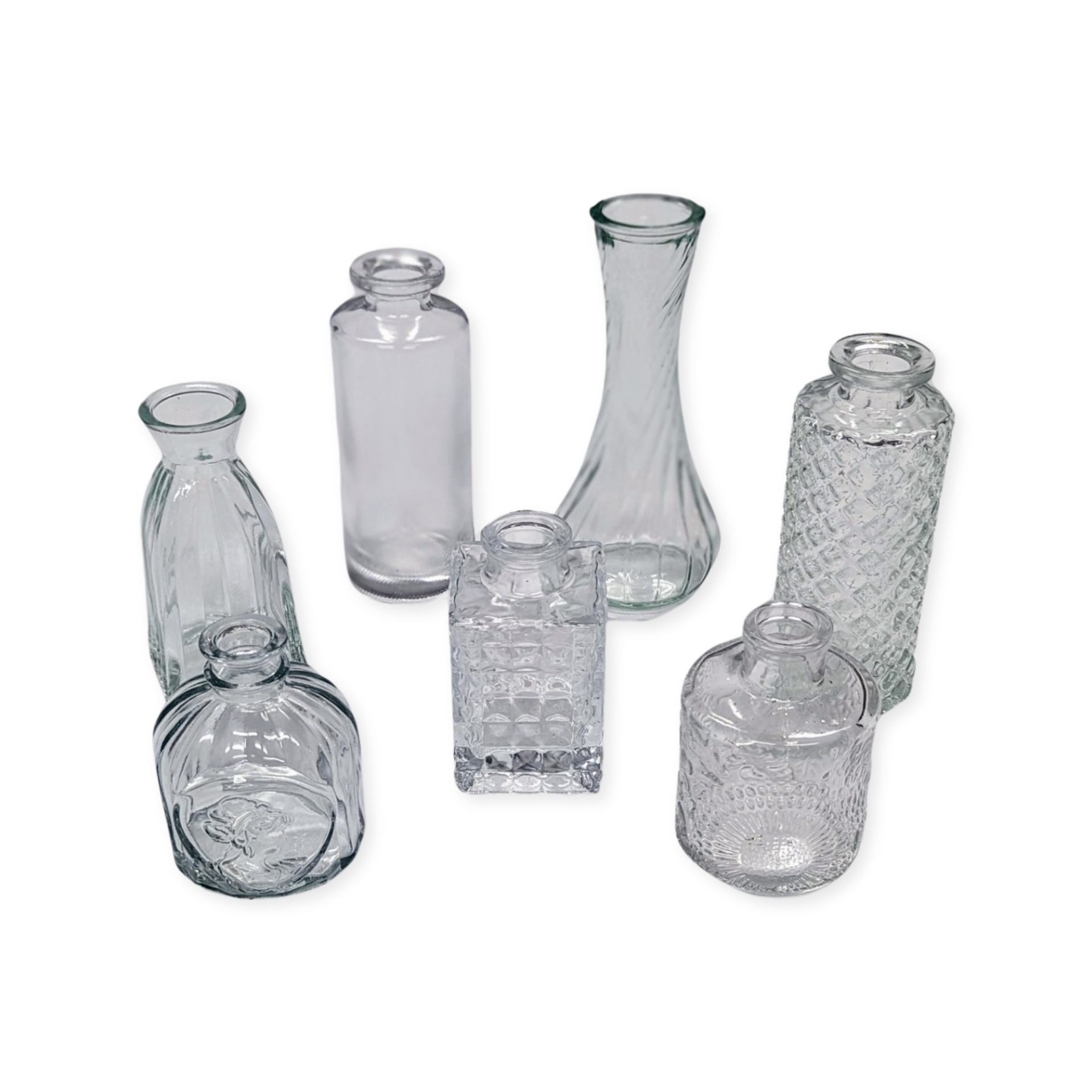 Assorted glass bud vases rental in panama city beach boho brown emerald green clear