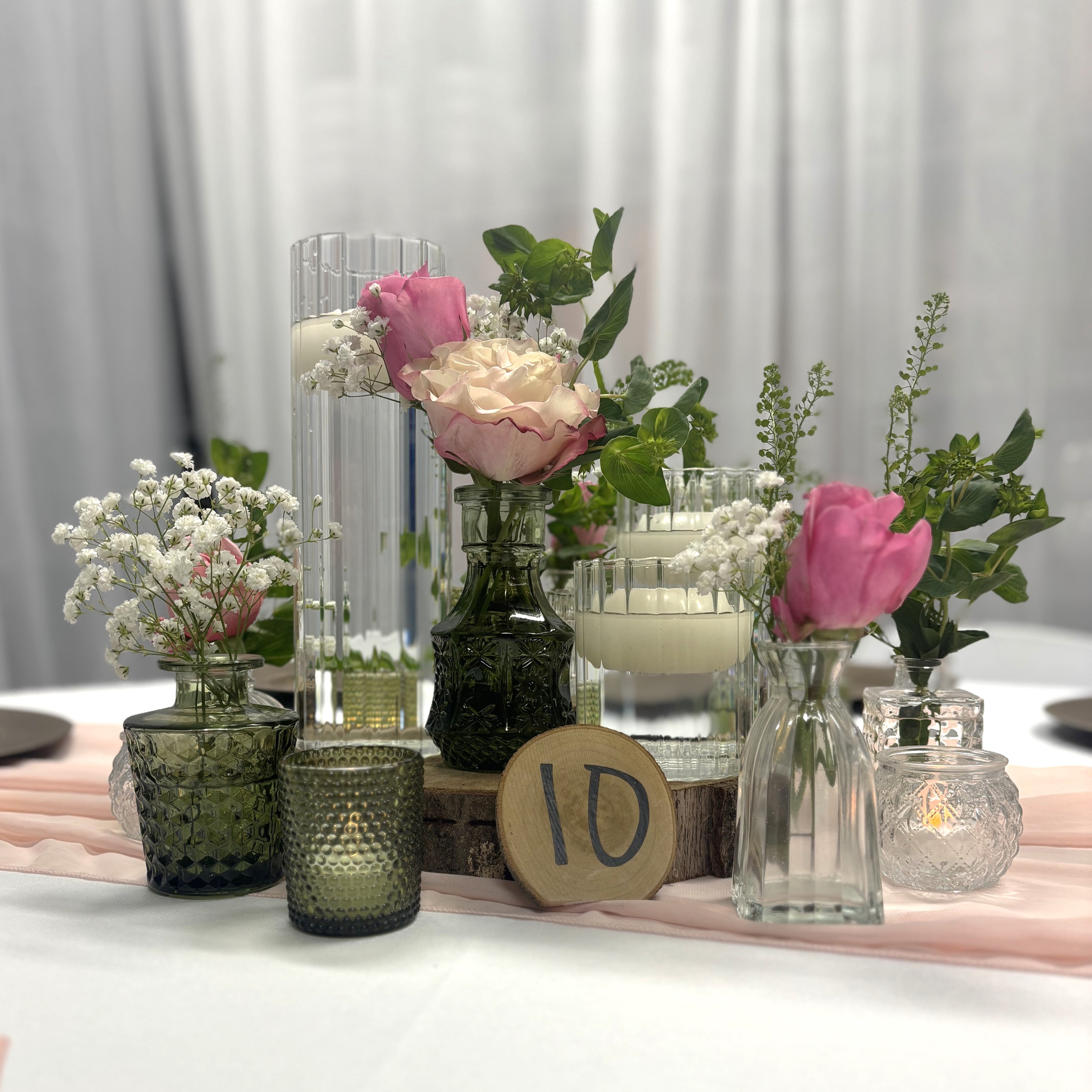 Lux centerpiece rental for weddings and events in panama city beach with bud vases, candles, and a table number!
