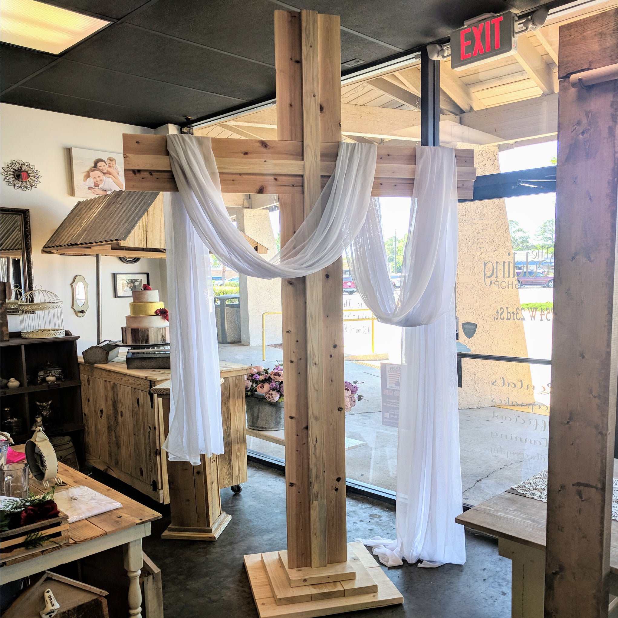 Oversized wooden wedding cross arbor rental in panama city beach florida