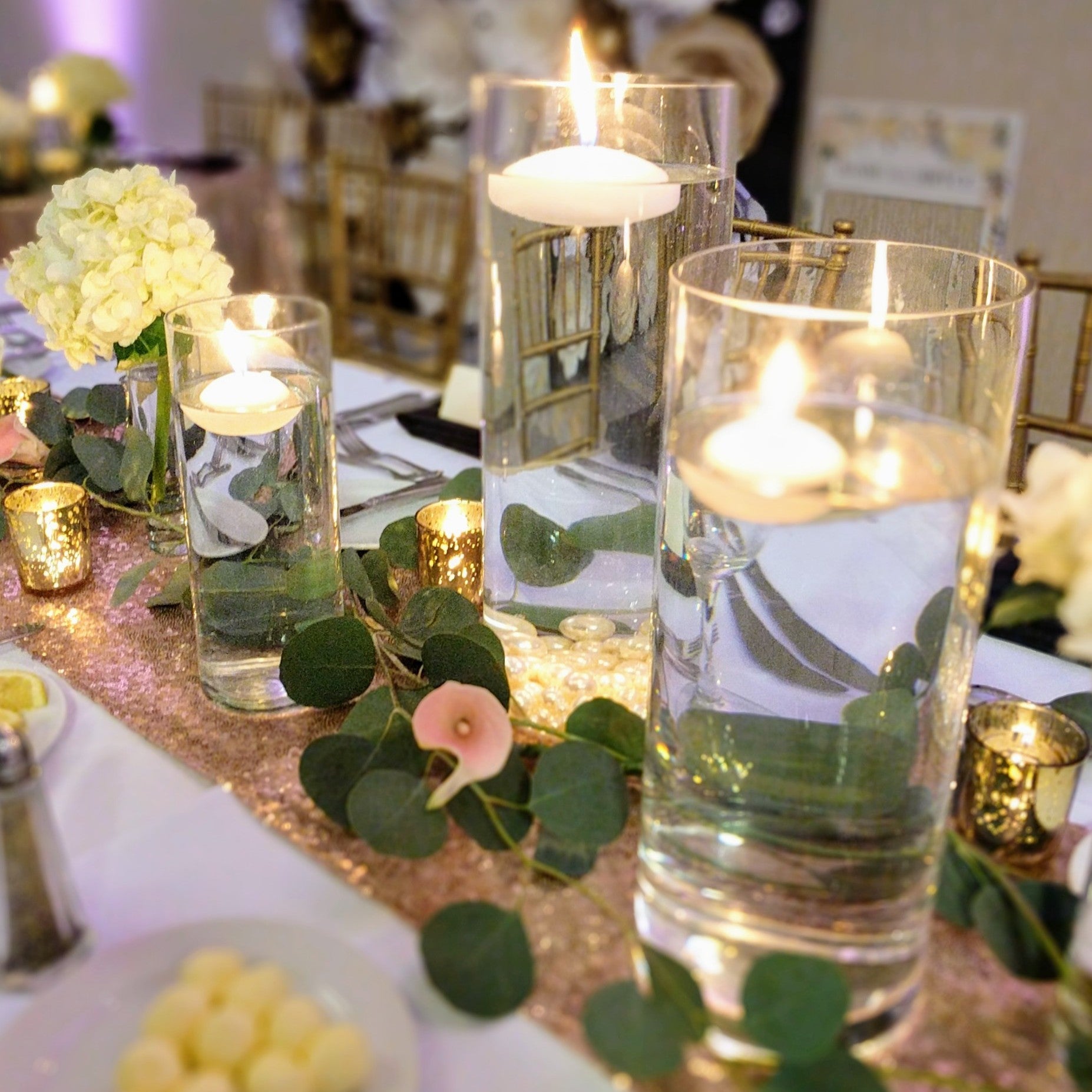 cylinder vase centerpiece rental in panama city beach floating candles