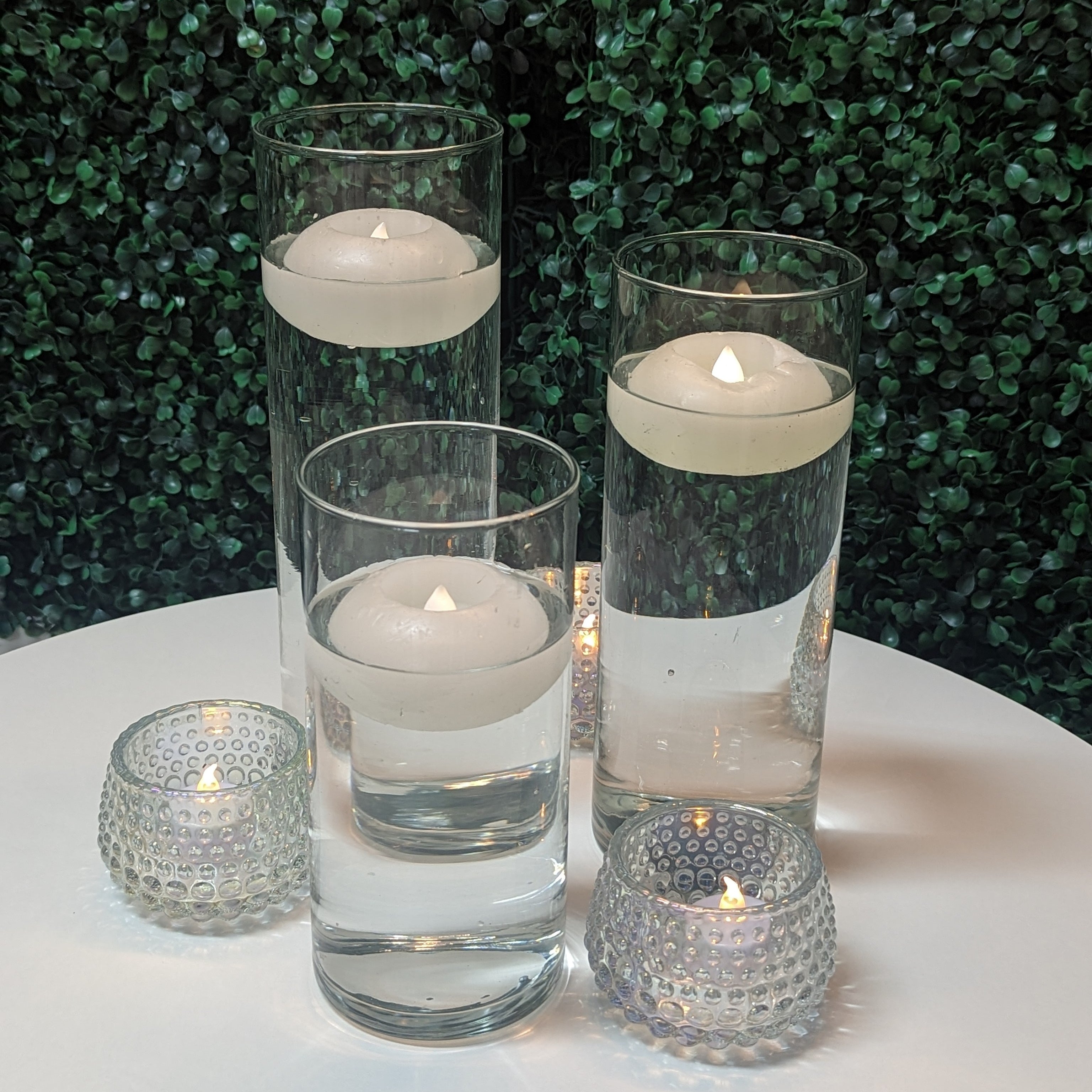 cylinder vase centerpiece rental with led floating candles in panama city beach