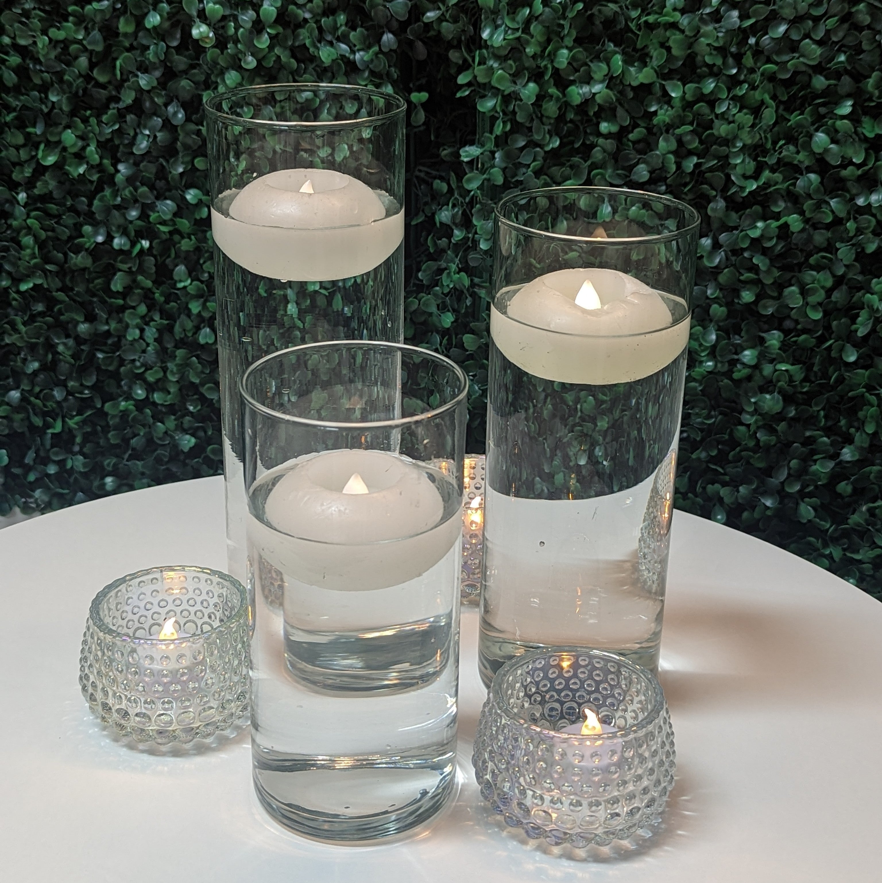 cylinder vase centerpiece rental with led floating candles in panama city beach