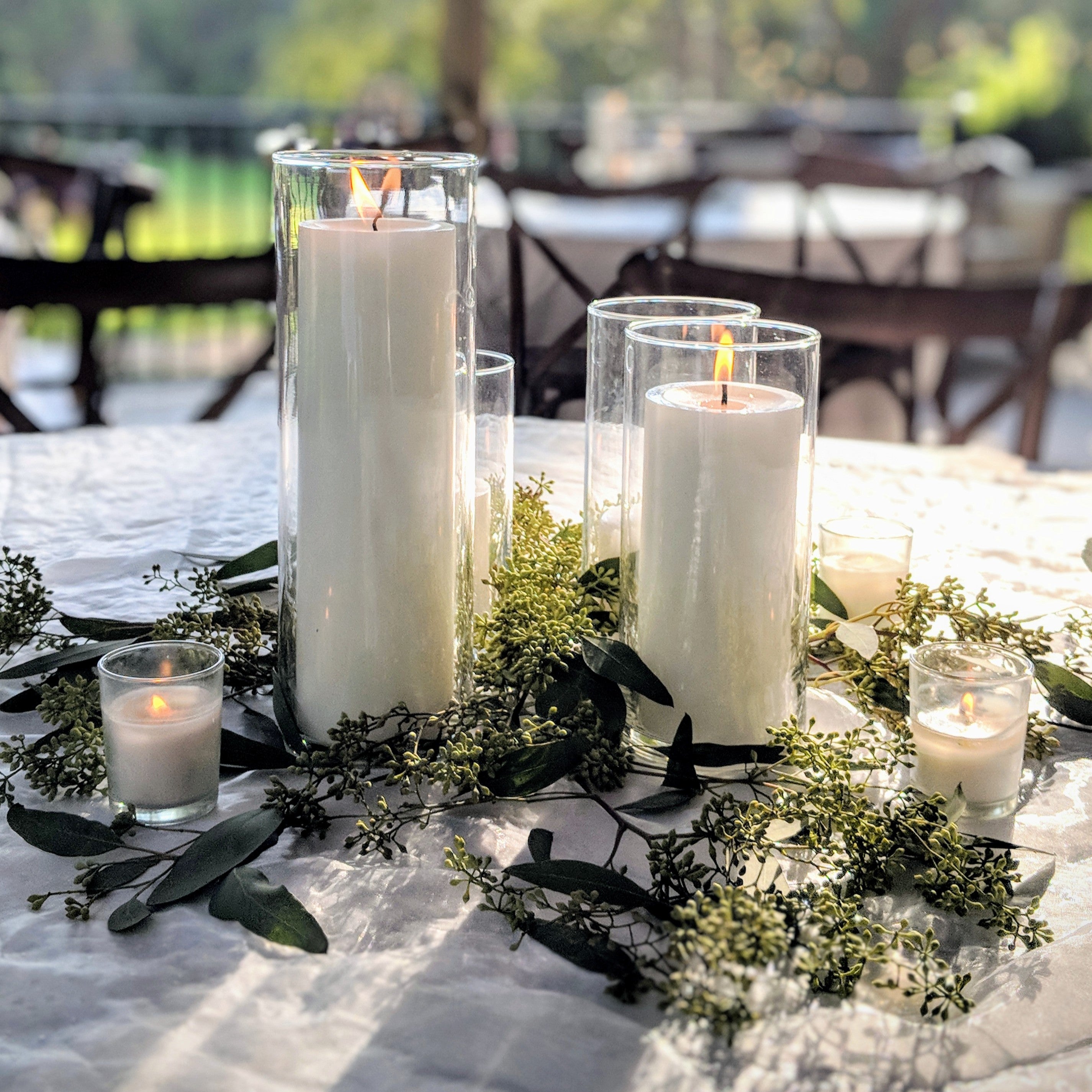 cylinder vase centerpiece rental in panama city beach pillar candles fresh greenery