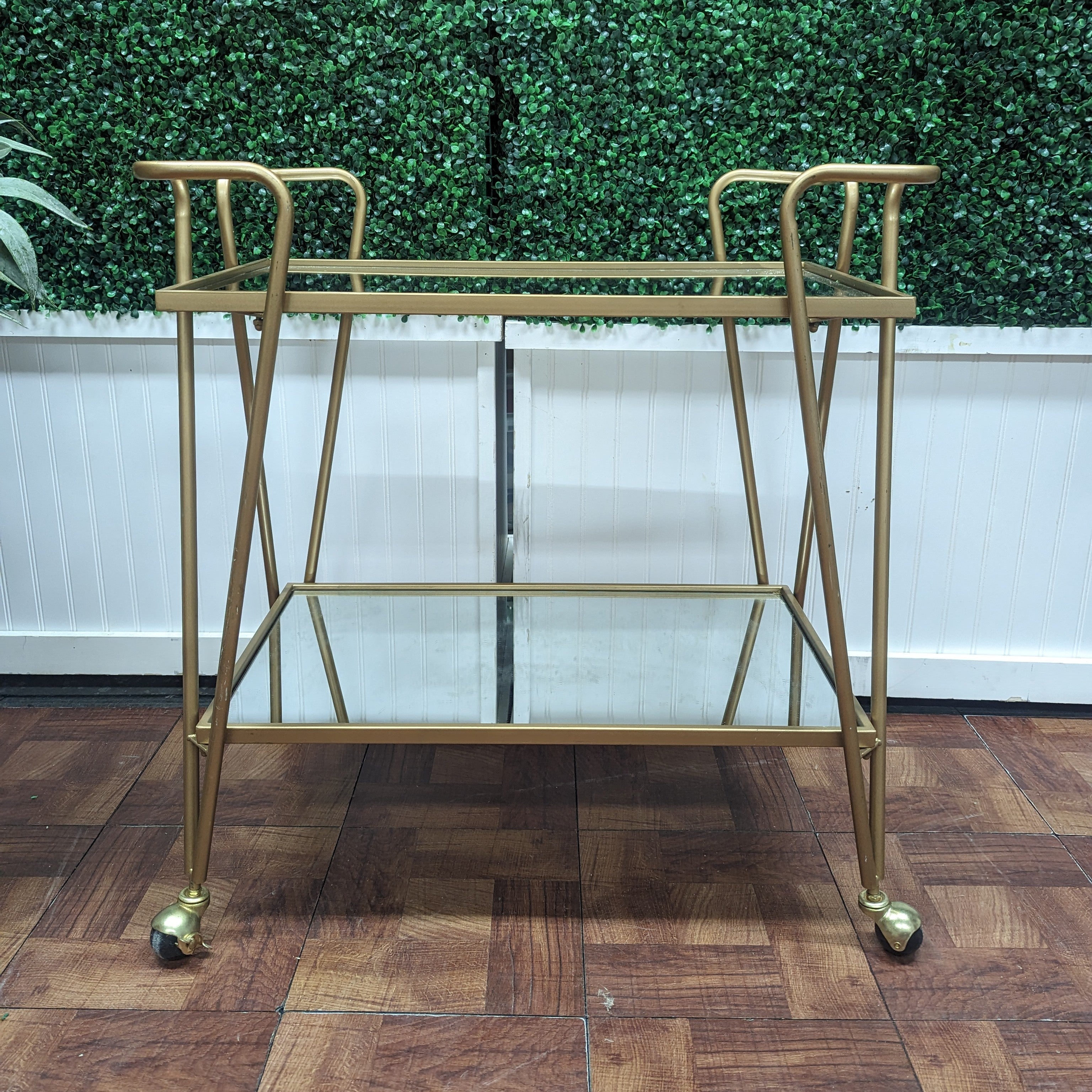 timeless gold metal two tiered bar cart with mirrored shelves