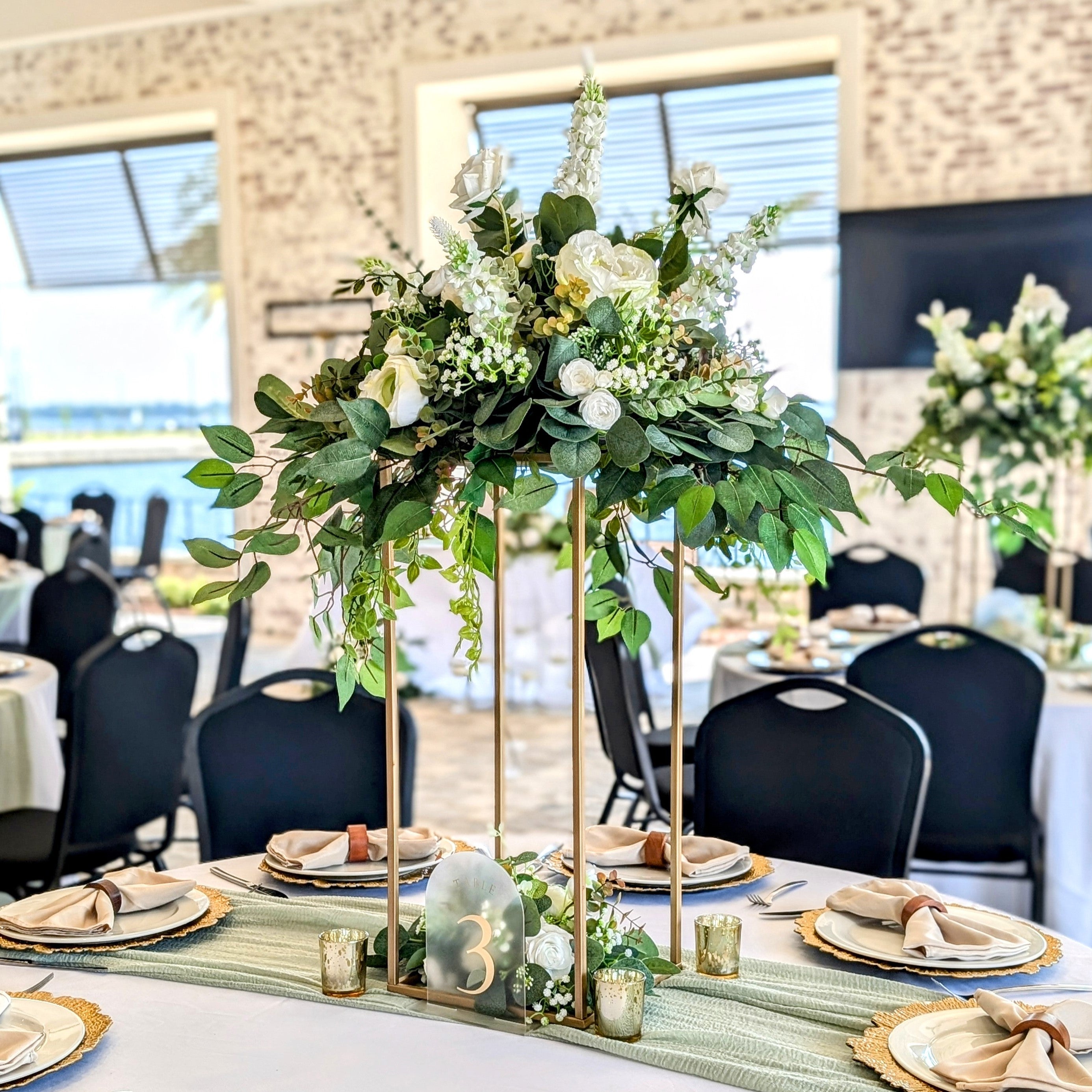 gold open frame flower stand centerpiece rental in panama city beach