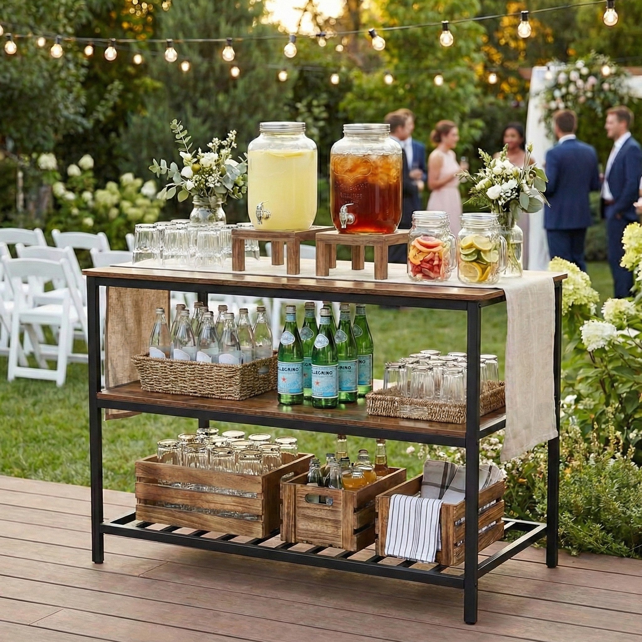 Outdoor drink station with lemonade and iced tea at a garden party.
