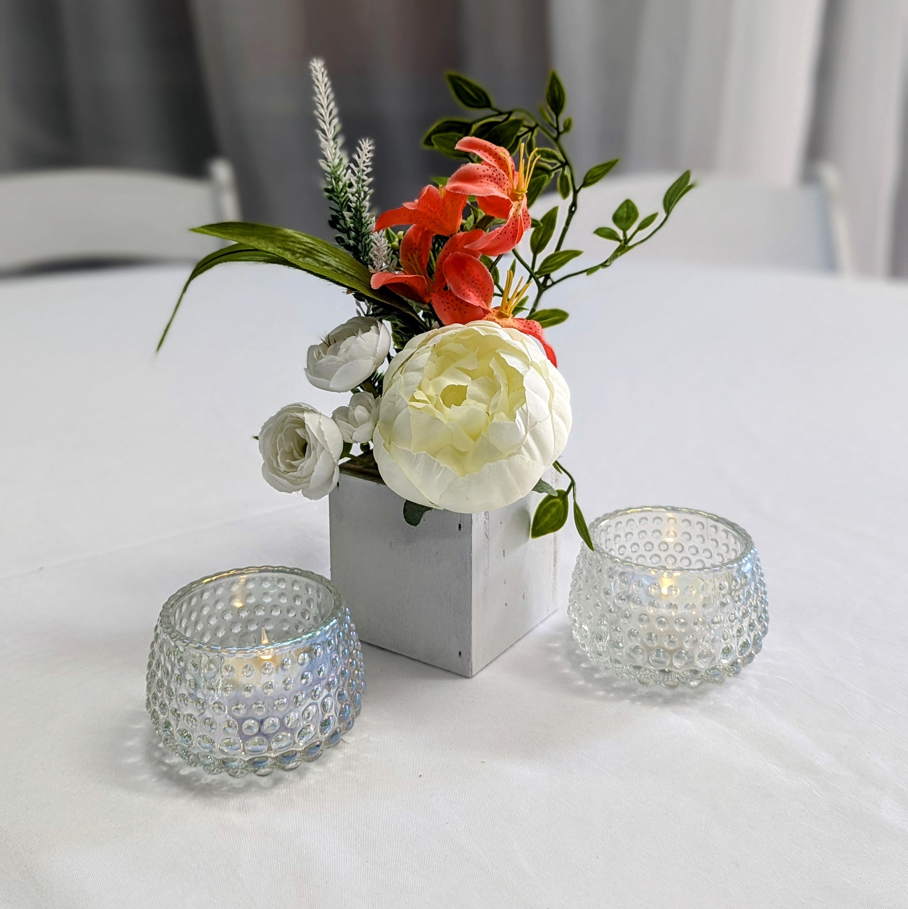 white mini floral box centerpiece rental in panama city beach custom created high end faux florals cocktail tables
