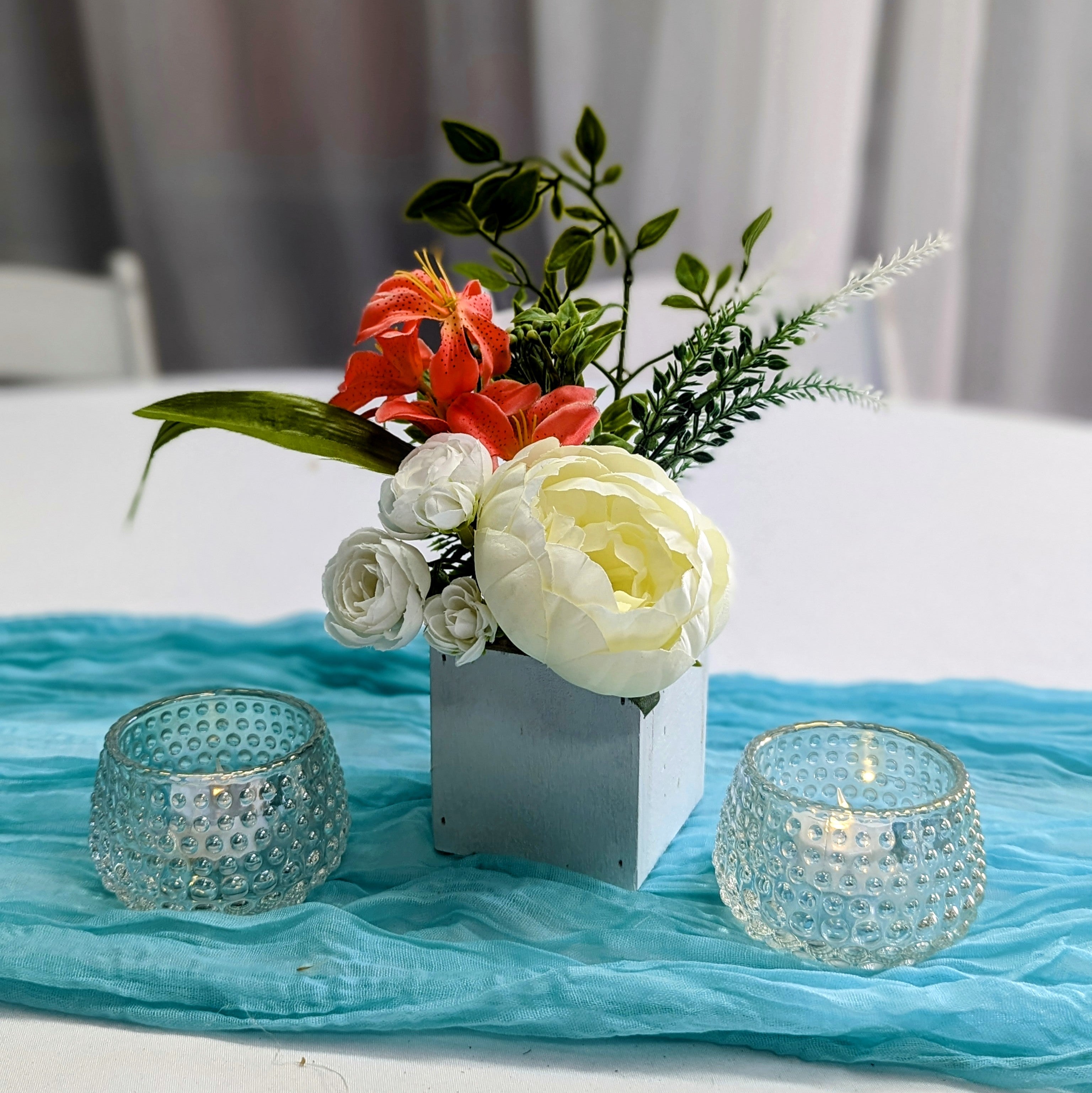 white mini floral box centerpiece rental in panama city beach cocktail table