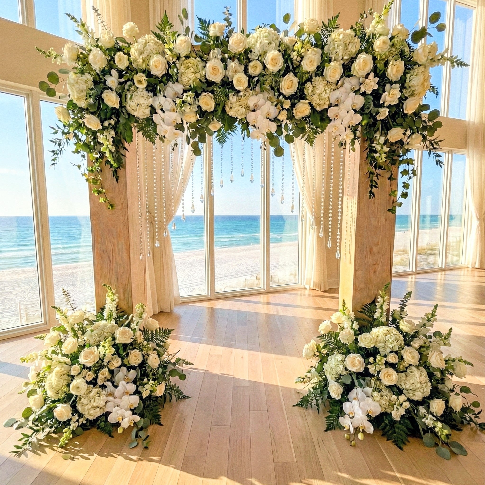 Floral arch rental and decorations in a room with large windows overlooking a beach in panama city beach