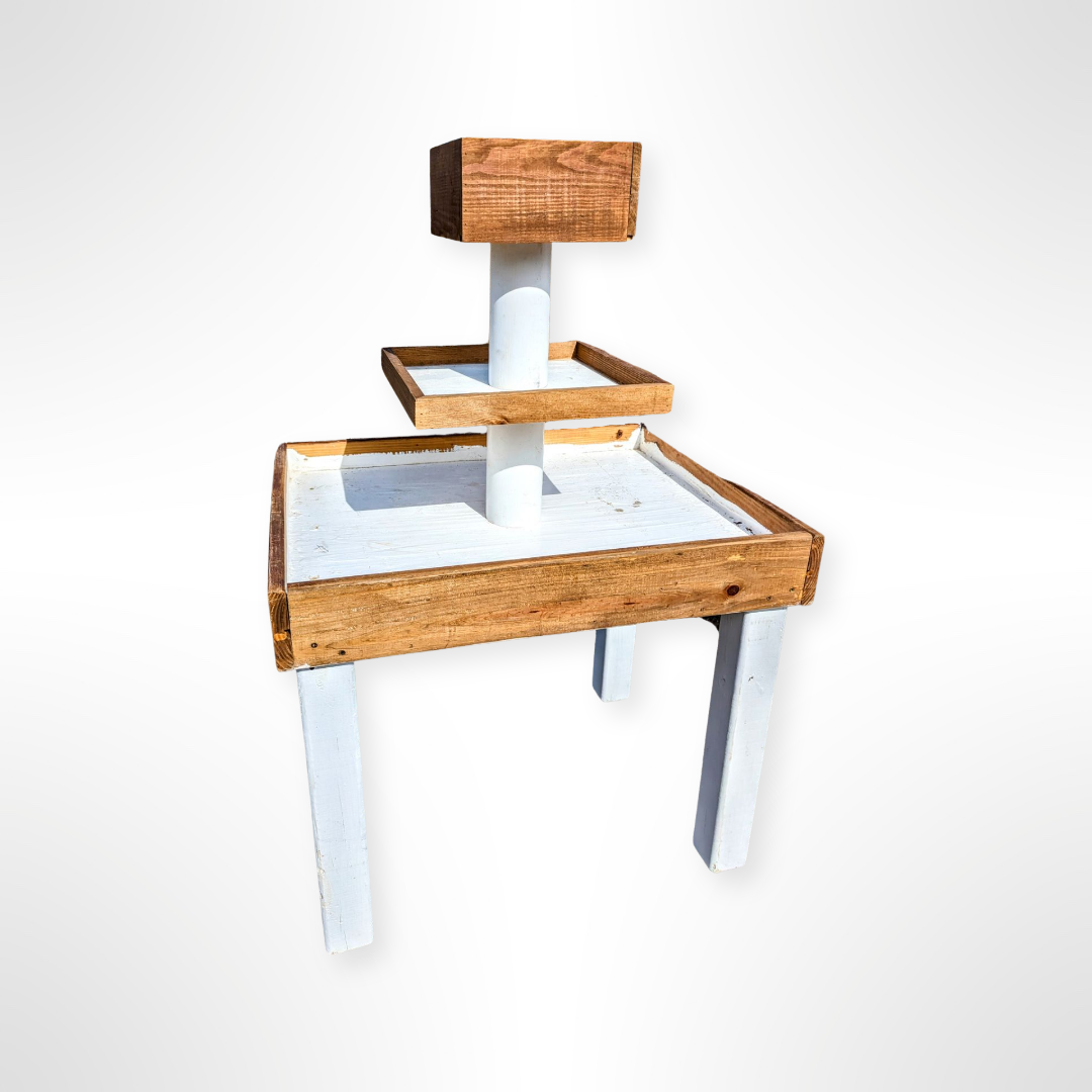 Wooden and white raw bar charcuterie tower rental in panama city 30a with multiple levels on a white background