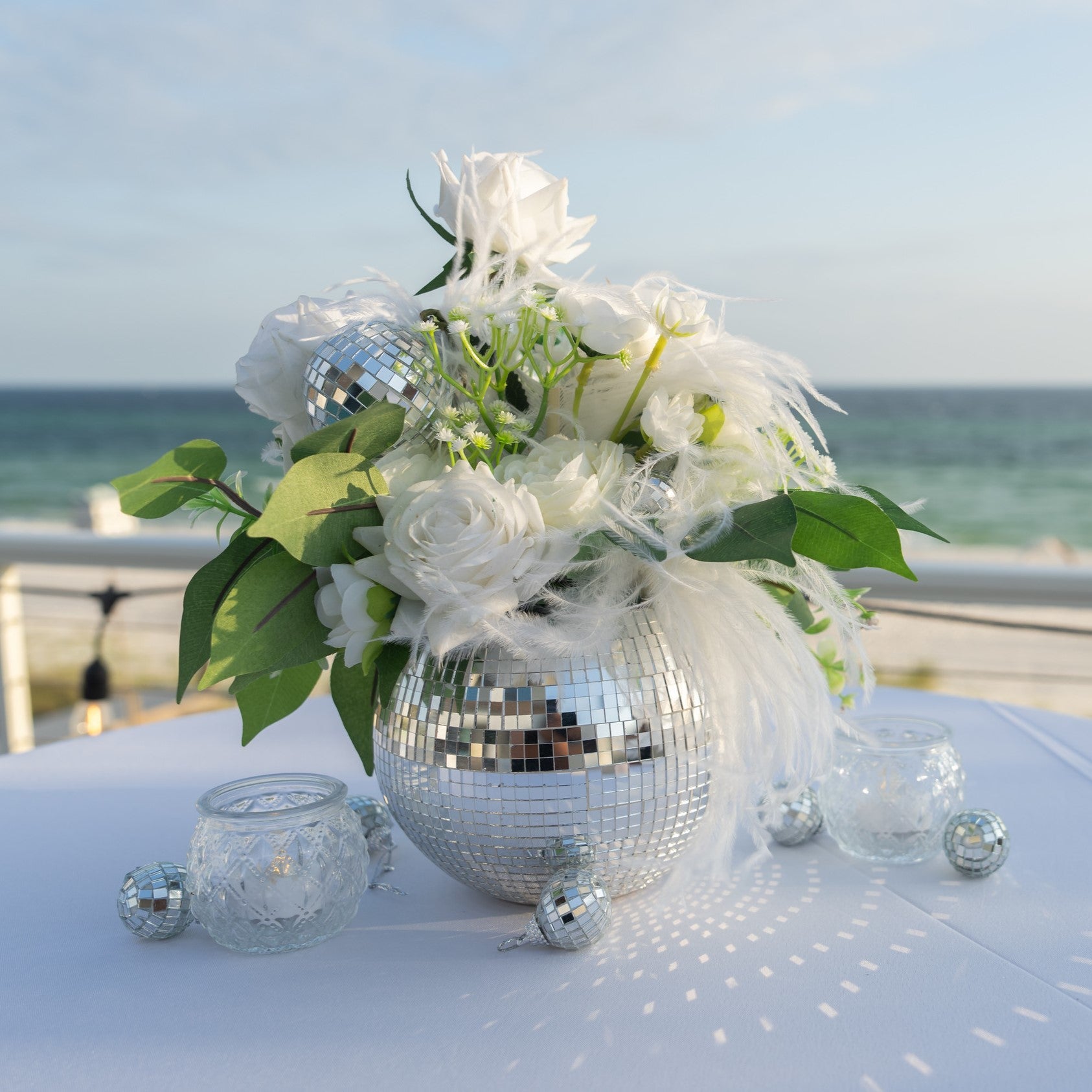 Silver disco ball centerpiece rental in panama city beach fun playful elegant