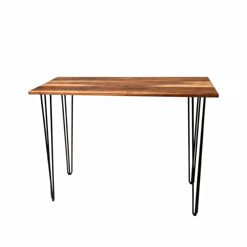 Wooden walnut table rental with metal hairpin legs on a white background