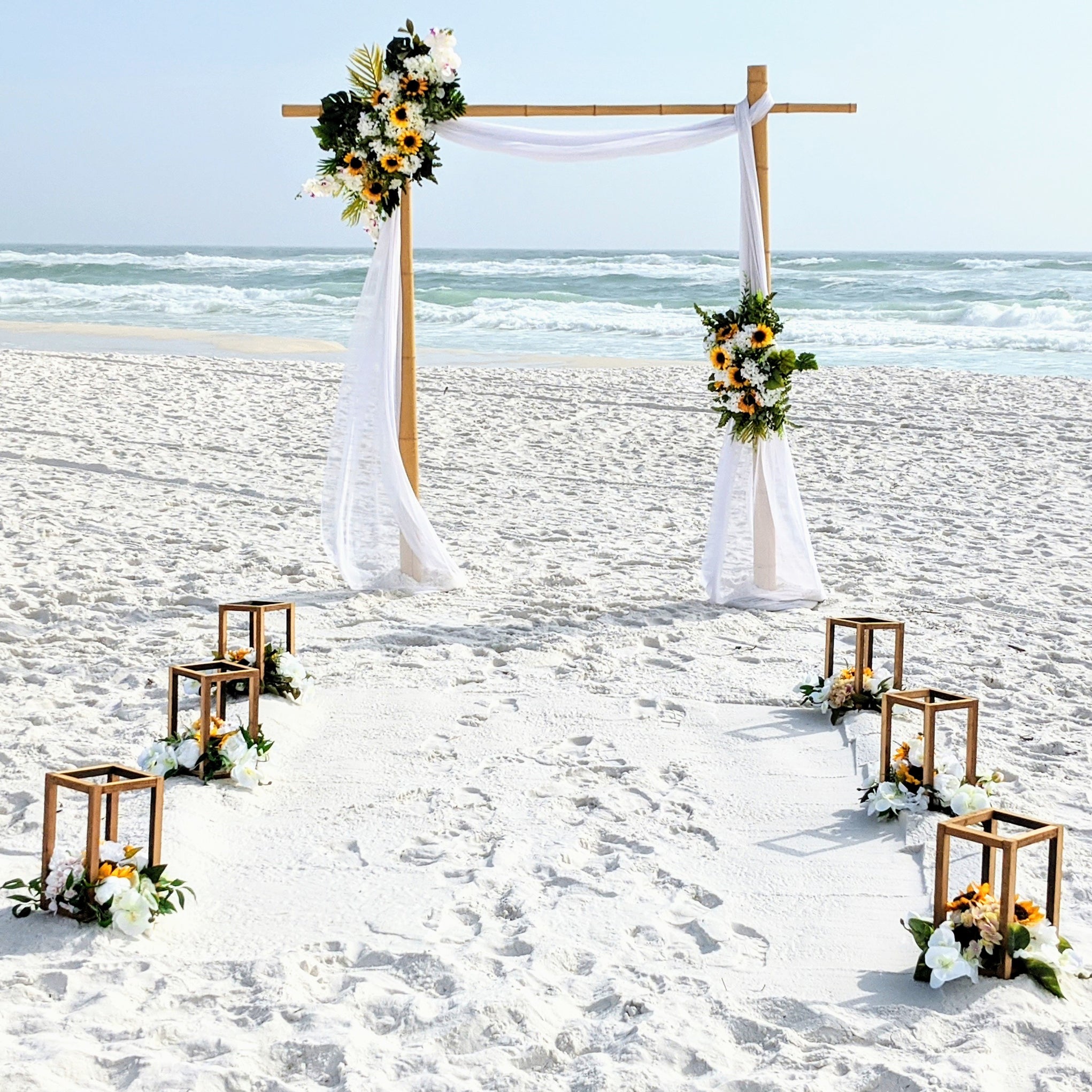 destination-beach-wedding-elopement-arbor-arch-rental-decorations-lantern-aisle-markers-panama-city-beach-wedding-planner-officiant-photographer-rentals-bamboo-arbor