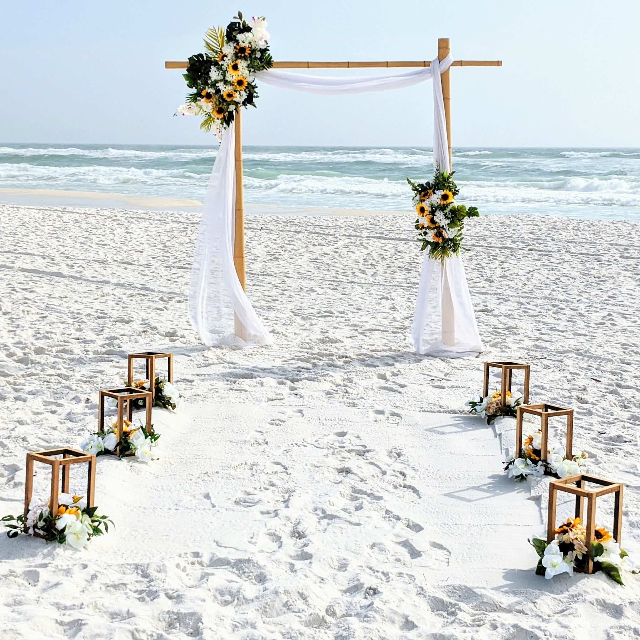destination-beach-wedding-elopement-arbor-arch-rental-decorations-lantern-aisle-markers-panama-city-beach-wedding-planner-officiant-photographer-rentals-bamboo-arbor