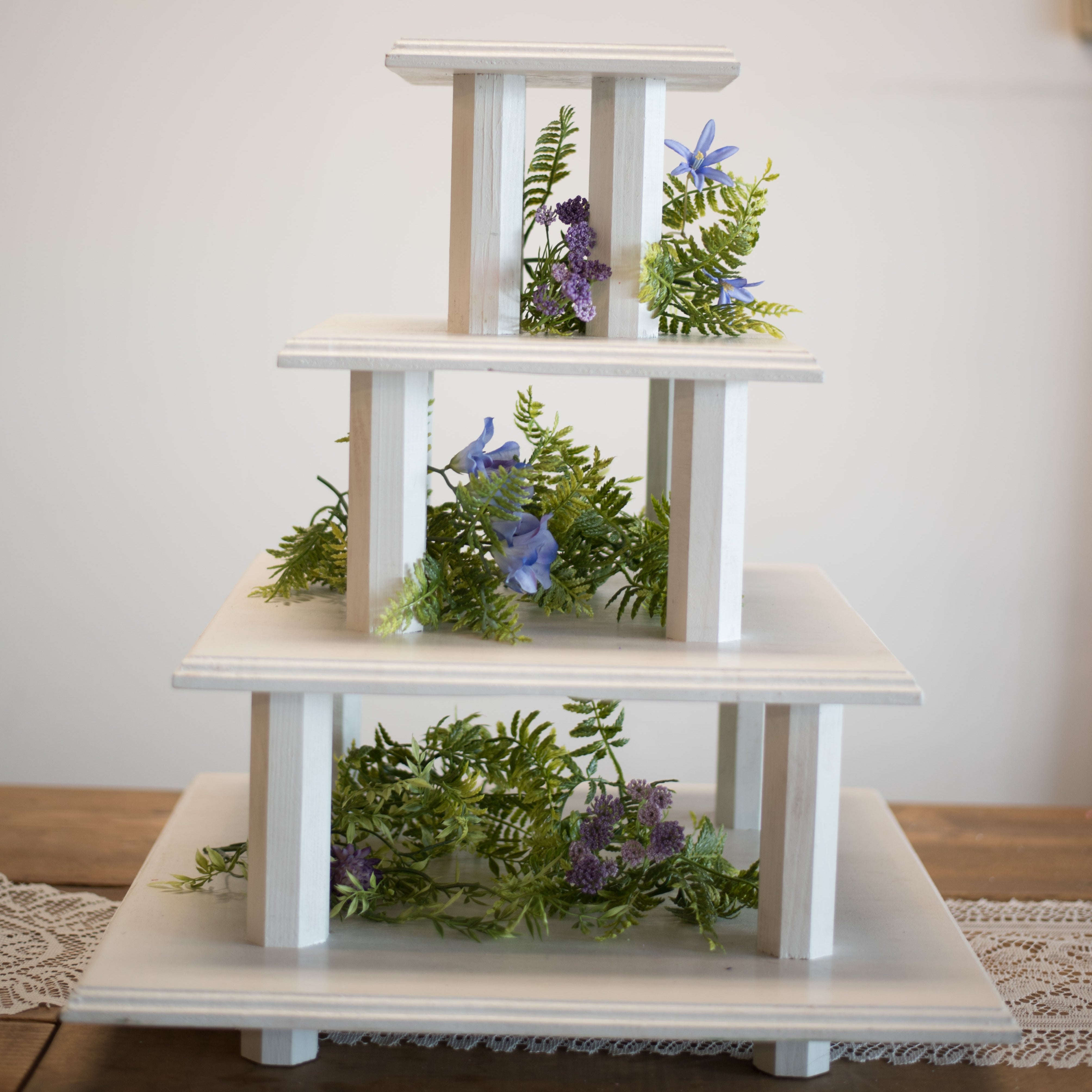 White square 4-tier wood cupcake and dessert stand rental in Panama City Beach 