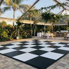 Black and white checkered dance floor rental Panama City Beach wedding.