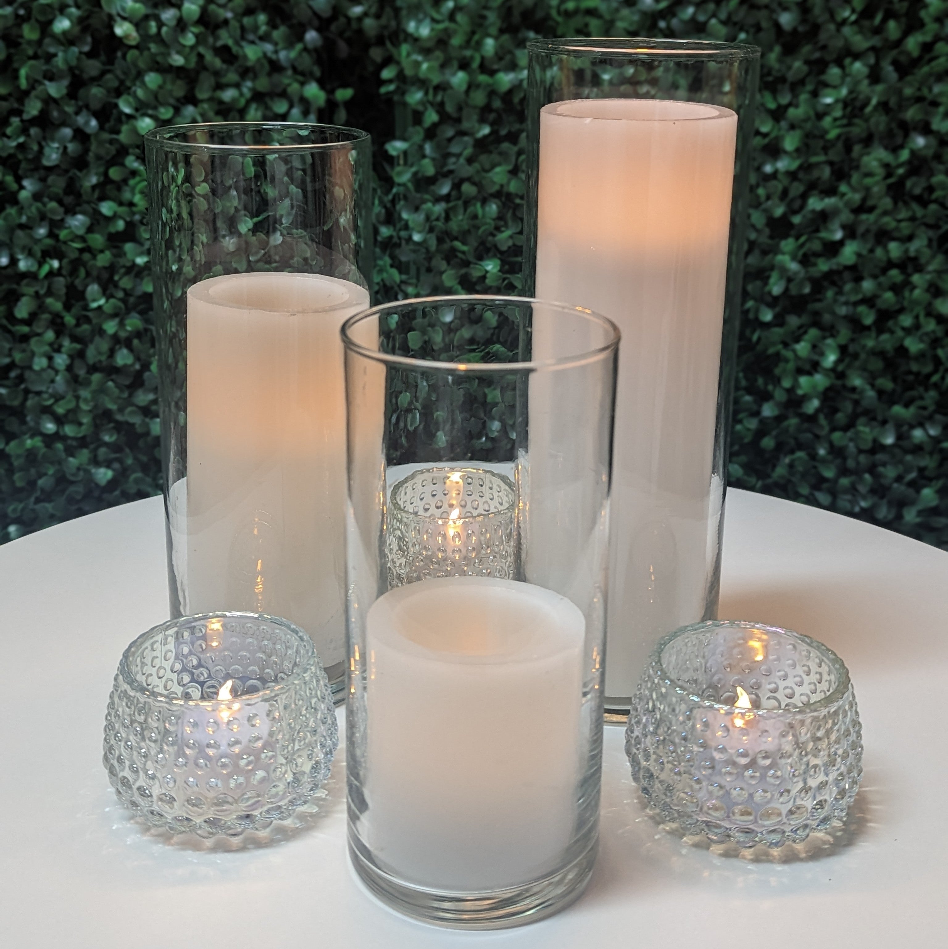cylinder vase cluster with led pillar candle centerpiece rental in Panama city beach