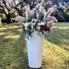 oversized white vase with florals entry marker rental 
