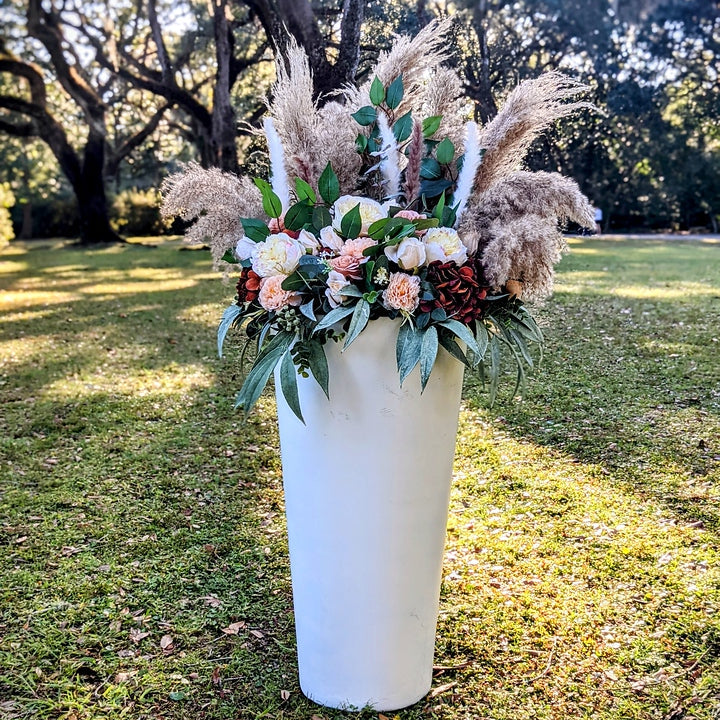 oversized white vase with florals entry marker rental 