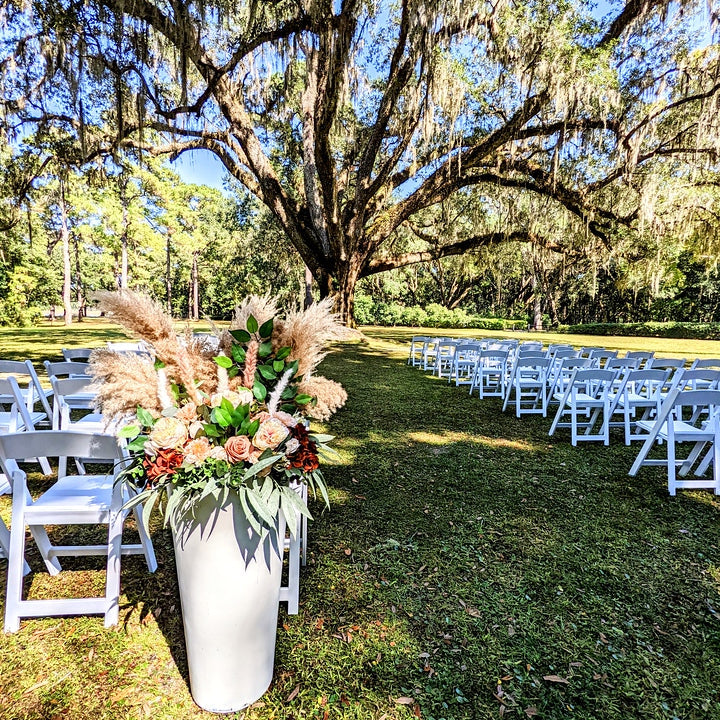 oversized white vase with florals entry marker rental 