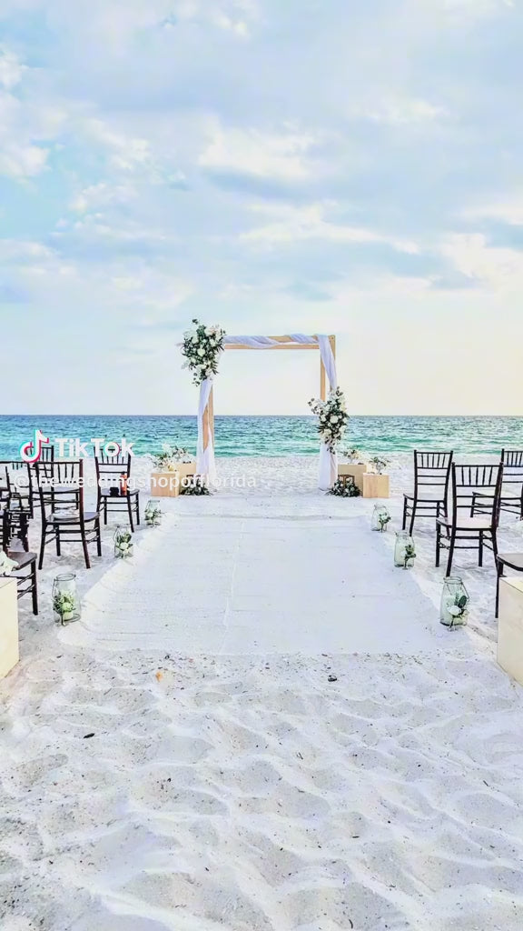 Destination beach wedding video in panama city beach at sunset with bonfire and beach reception.