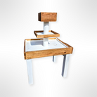 Wooden and white raw bar charcuterie tower rental in panama city 30a with multiple levels on a white background