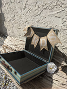 blue green and wood vintage suitcase with metal and leather details for wedding or party use as a card holder or display 