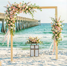 Floral arch on a beach with ocean view