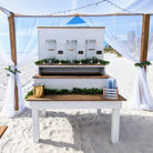 Beach bar rental in panama city beach 30a setup with jars and bottles on a sandy beach