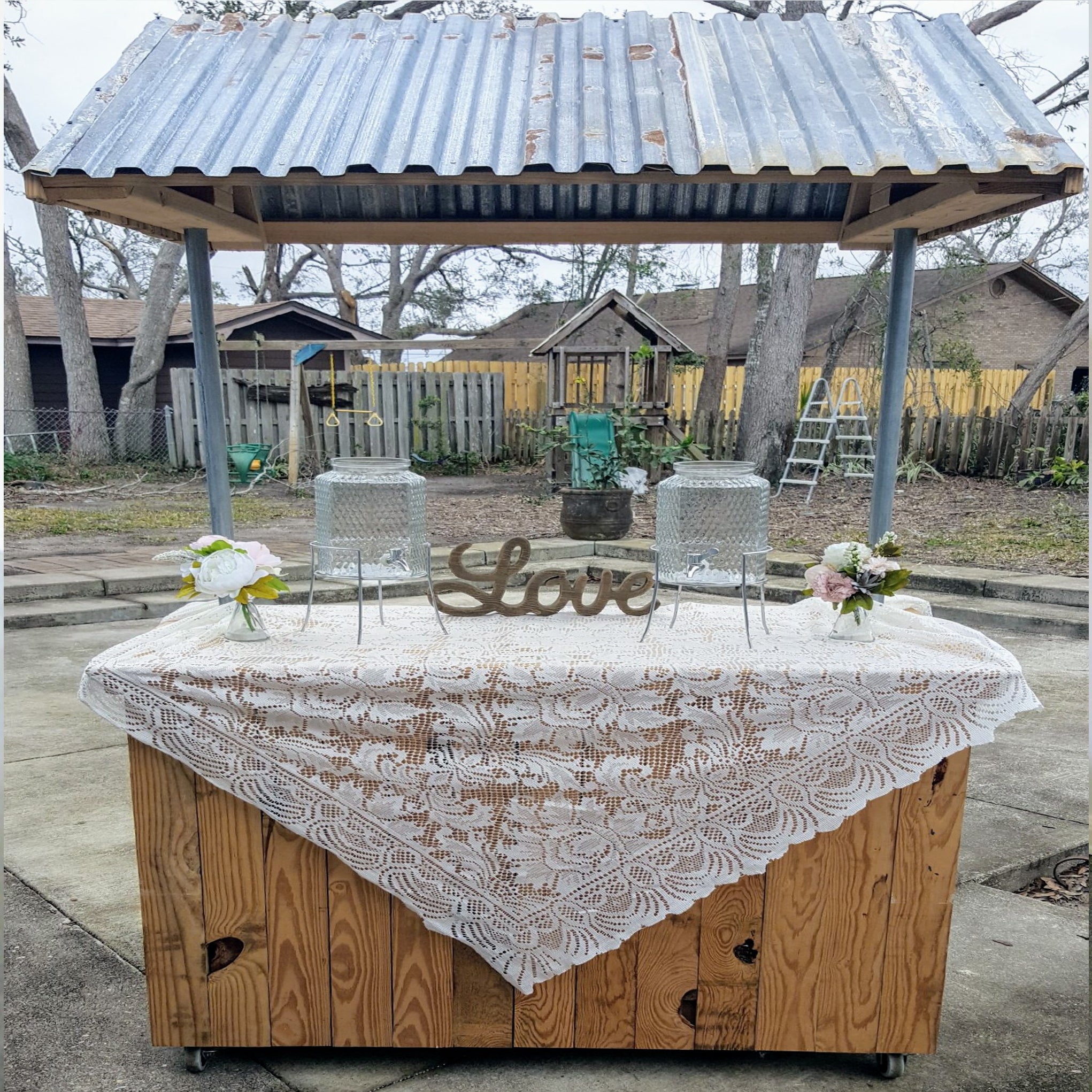 unique rustic wishing well bar table with wooden base and galvanized tin metal roof for rent 