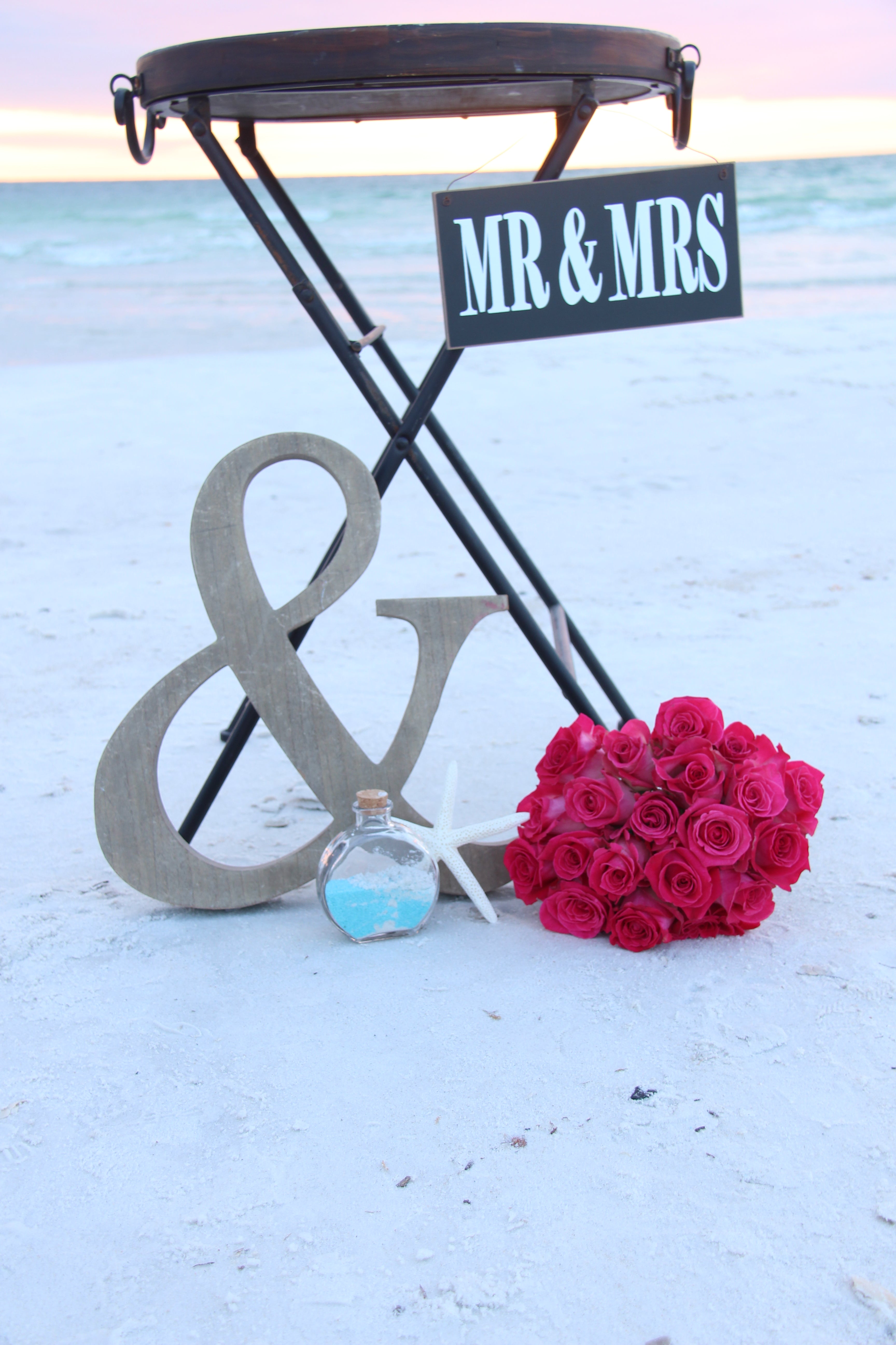 small tray table with wooden top handles and black metal legs for wedding or event to display favors or decor