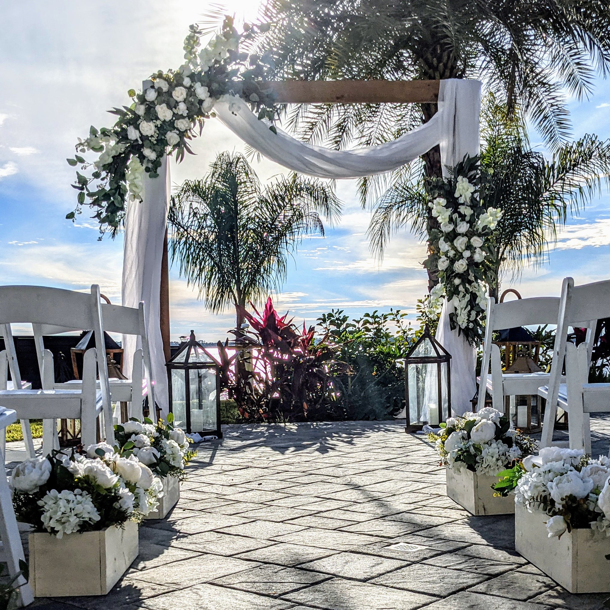 destination-beach-wedding-elopement-arbor-arch-rental-decorations-lantern-aisle-markers-panama-city-beach-wedding-planner-officiant-photographer-rentals