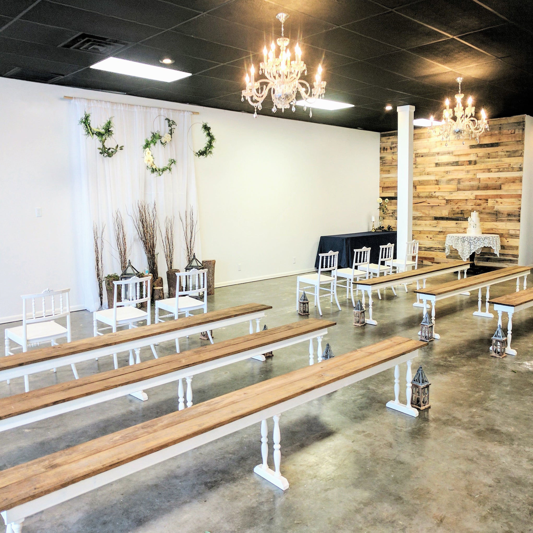 2-toned spindle leg bench seating rental for an indoor wedding ceremony by the weddings shop for weddings in panama city beach on the emerald coast